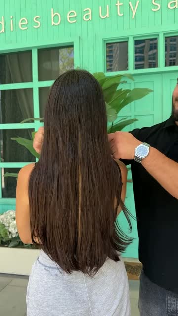 Balayage lengths checked in front of the turquoise storefront